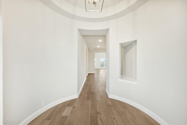 hallway with light hardwood / wood-style flooring