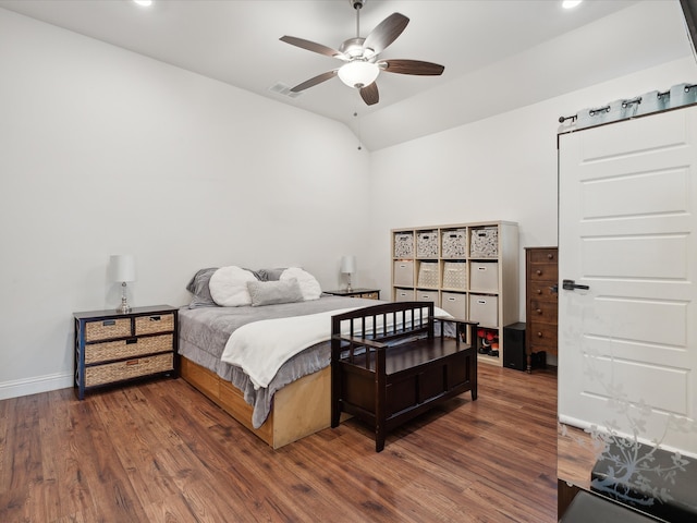 bedroom with lofted ceiling, ceiling fan, and dark hardwood / wood-style floors