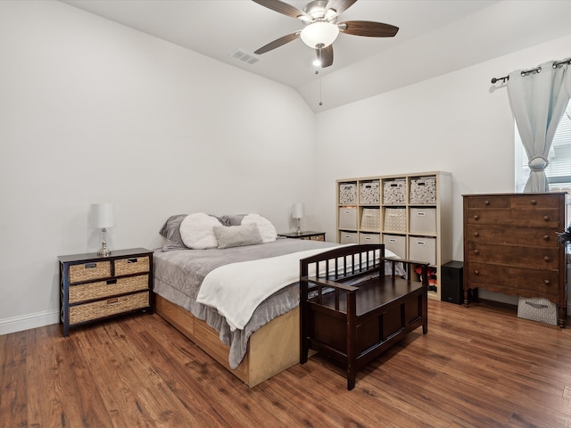 bedroom with lofted ceiling, ceiling fan, and dark hardwood / wood-style floors