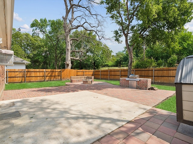 view of patio / terrace featuring an outdoor fire pit