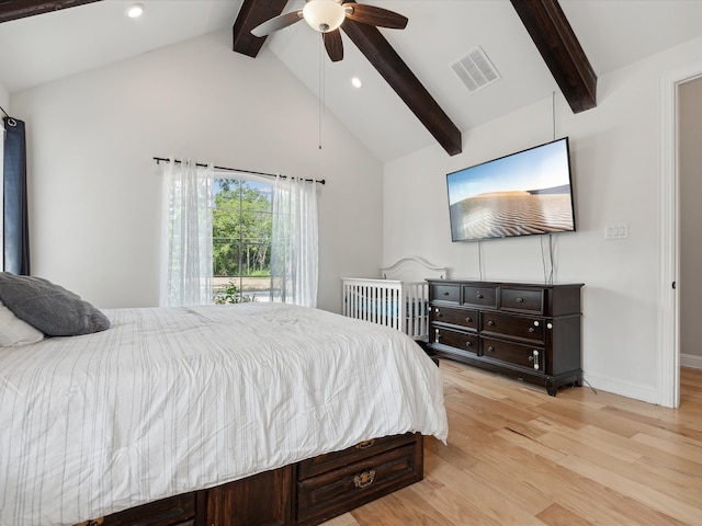 bedroom with light wood-type flooring, ceiling fan, and lofted ceiling with beams