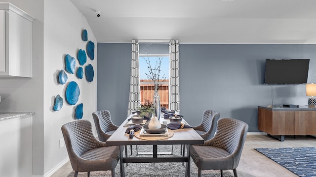 dining space with light tile patterned floors