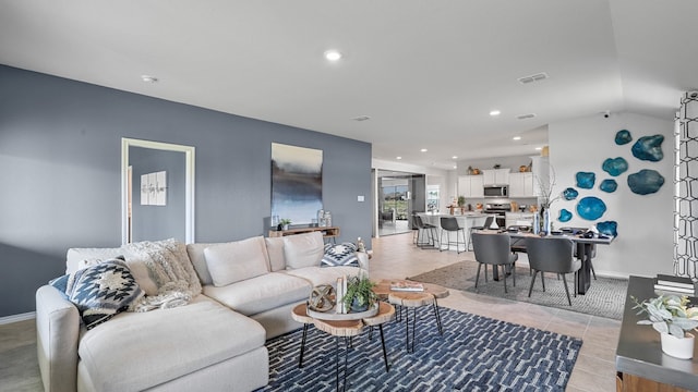 tiled living room with vaulted ceiling