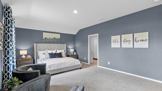 bedroom featuring lofted ceiling and carpet flooring