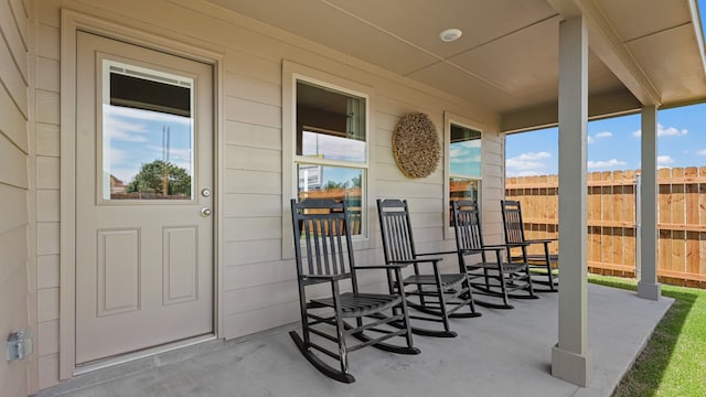 view of exterior entry featuring a porch