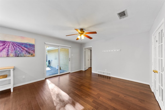 interior space with ceiling fan and dark hardwood / wood-style floors