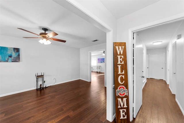 hall with dark hardwood / wood-style floors