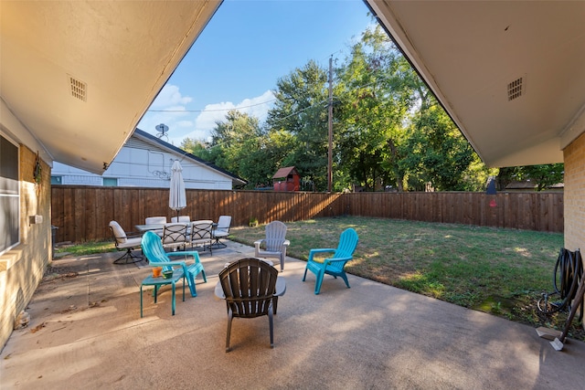 view of patio / terrace featuring an outdoor fire pit