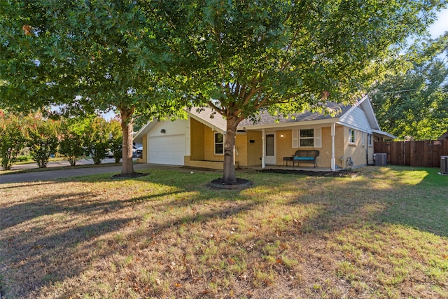 ranch-style house with central AC, a front yard, and a garage