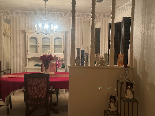 carpeted dining space featuring a notable chandelier