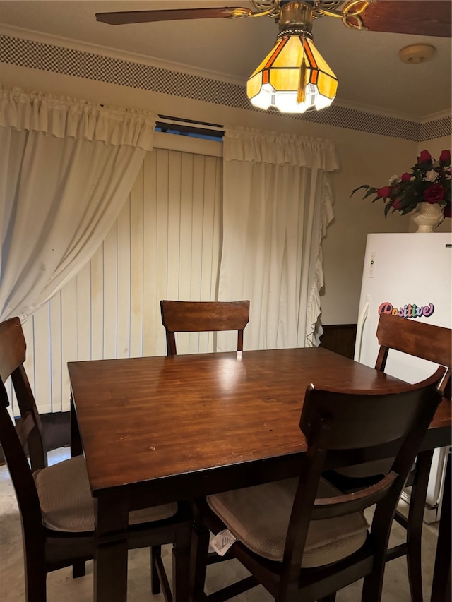 dining room featuring ornamental molding and ceiling fan