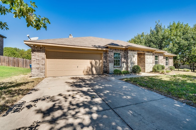 ranch-style home featuring a garage and a front lawn