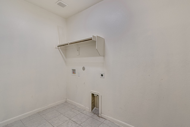 clothes washing area with hookup for a washing machine, light tile patterned floors, electric dryer hookup, and hookup for a gas dryer