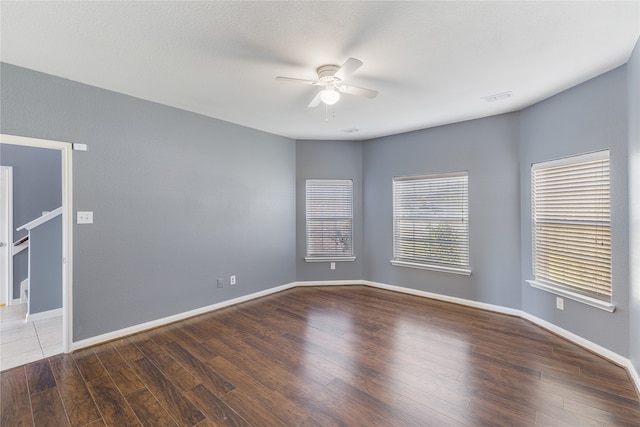 spare room featuring hardwood / wood-style flooring and ceiling fan