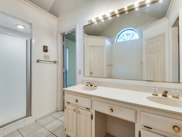 bathroom with lofted ceiling, vanity, a shower with door, and tile patterned floors