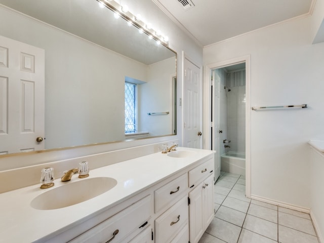 bathroom with ornamental molding, vanity, tiled shower / bath combo, and tile patterned floors