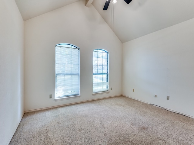 spare room featuring high vaulted ceiling, beam ceiling, ceiling fan, and carpet flooring