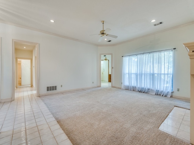 empty room with crown molding, ceiling fan, and light carpet