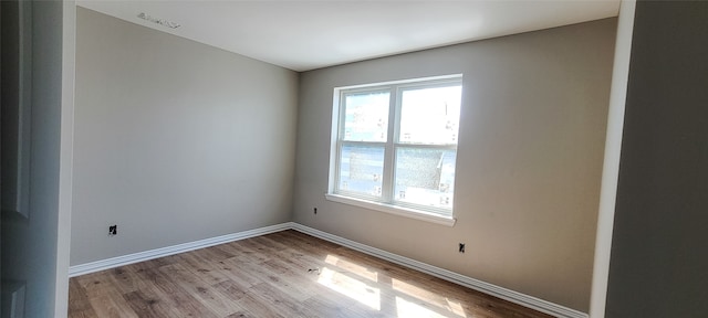 unfurnished room featuring light wood-type flooring