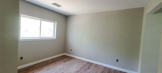 spare room with light wood-type flooring