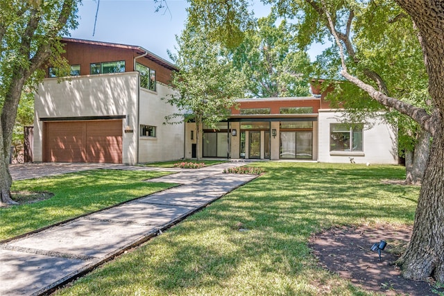 contemporary home featuring a front lawn