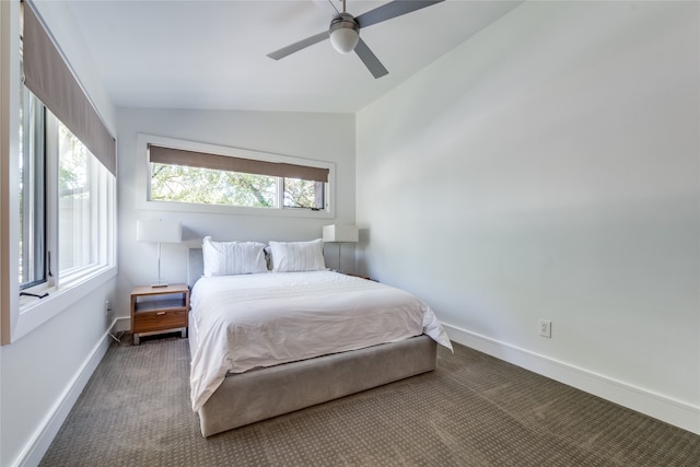 bedroom featuring lofted ceiling, ceiling fan, and carpet flooring