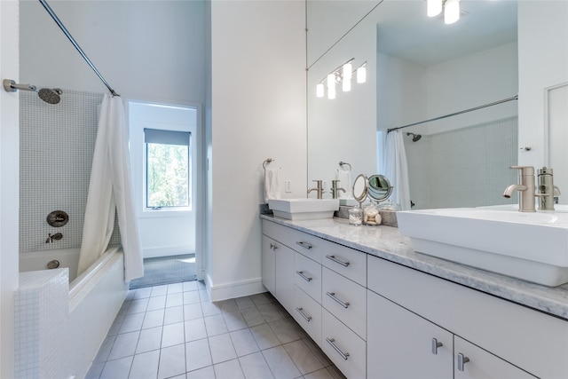 bathroom featuring tile patterned flooring, shower / tub combo with curtain, and vanity