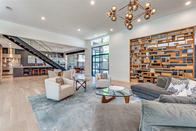 living room featuring hardwood / wood-style flooring and a notable chandelier