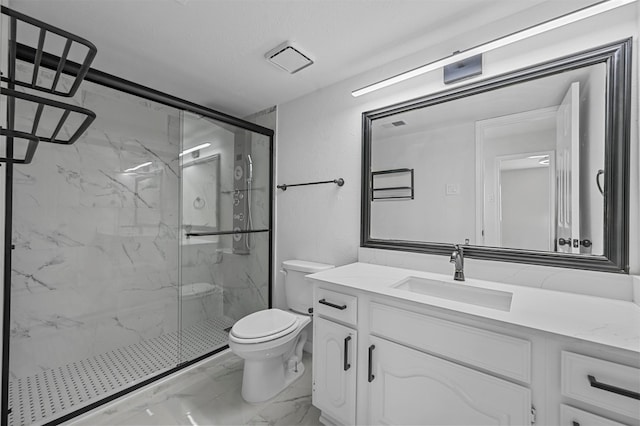 bathroom featuring vanity, toilet, and an enclosed shower