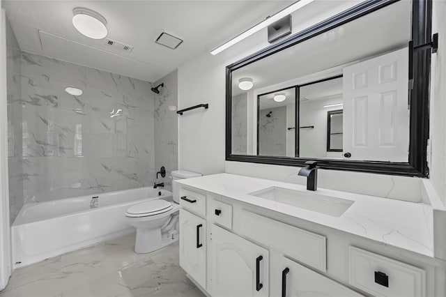 full bathroom featuring tiled shower / bath combo, vanity, and toilet