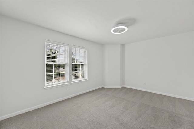 unfurnished room with carpet flooring