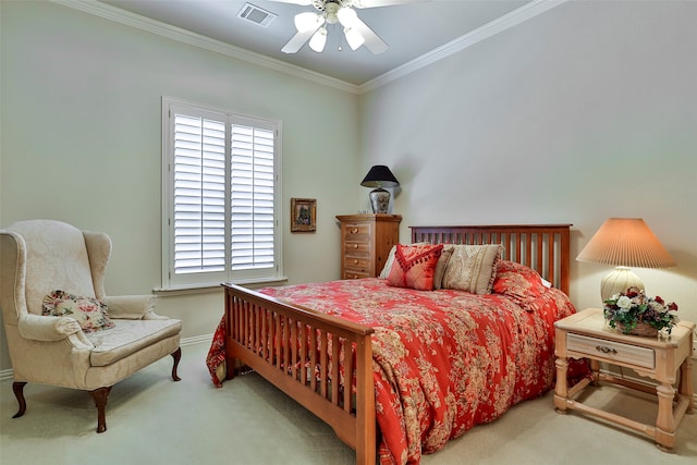 carpeted bedroom with crown molding and ceiling fan