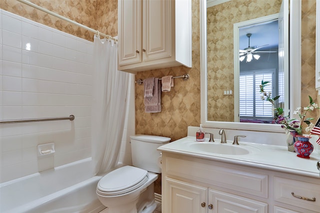 full bathroom featuring vanity, toilet, ceiling fan, and shower / bath combo