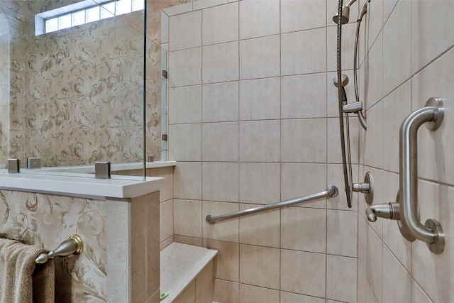 bathroom with tiled shower