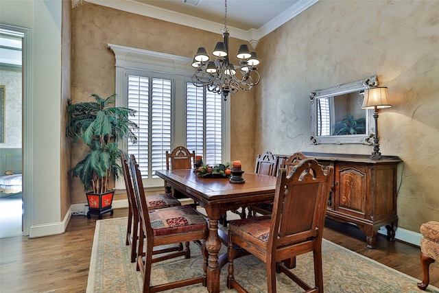 dining space with hardwood / wood-style flooring, a notable chandelier, and ornamental molding