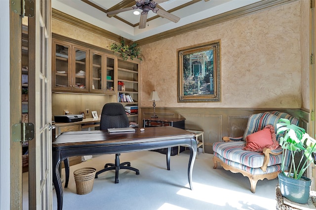 carpeted home office with ornamental molding and ceiling fan