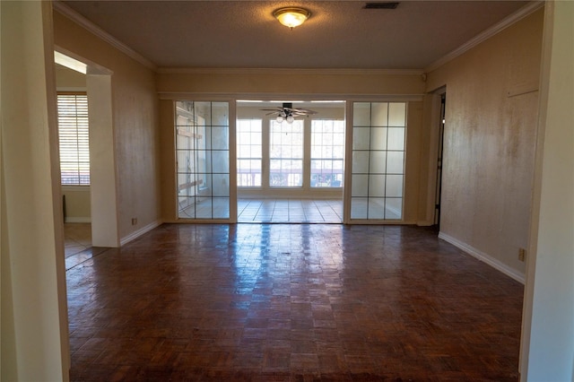 unfurnished room featuring dark parquet floors, ceiling fan, and a wealth of natural light