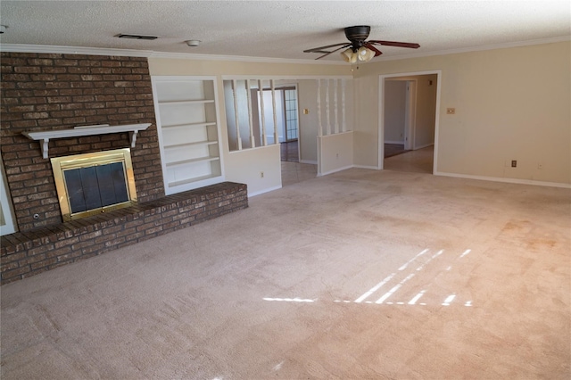 unfurnished living room featuring a textured ceiling, a fireplace, light carpet, ornamental molding, and ceiling fan