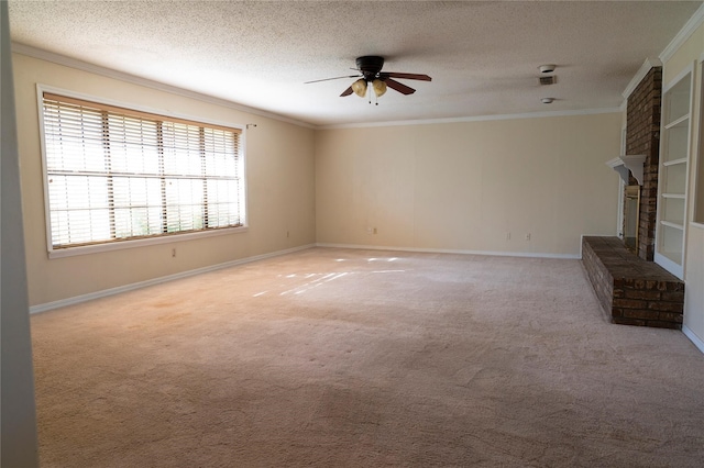 interior space with a fireplace, crown molding, light carpet, ceiling fan, and a textured ceiling