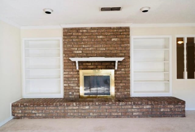 unfurnished living room with built in features, a fireplace, crown molding, and carpet floors