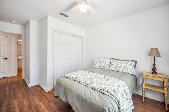 bedroom featuring a closet, ceiling fan, and dark hardwood / wood-style floors