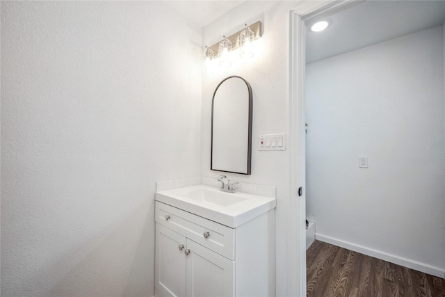 bathroom featuring hardwood / wood-style floors and vanity