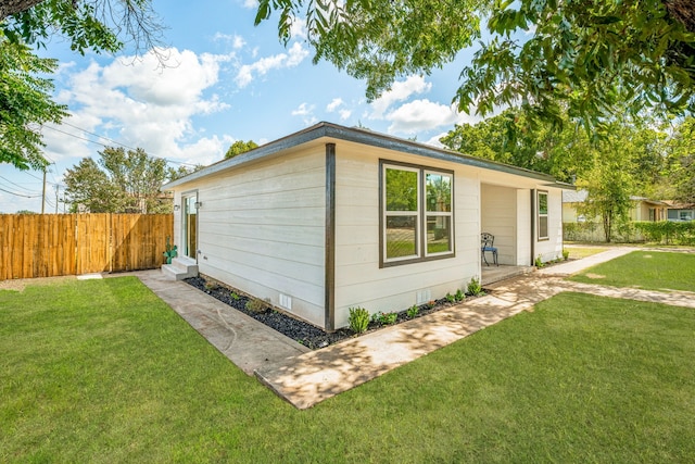 view of home's exterior featuring a lawn