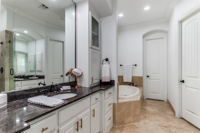 bathroom with vanity, crown molding, and separate shower and tub