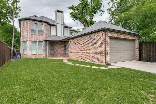 view of front facade featuring a front yard and a garage