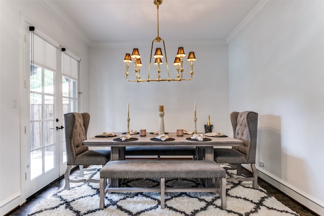 dining area featuring crown molding, a chandelier, dark wood-type flooring, and plenty of natural light