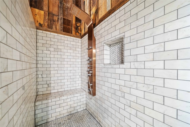 bathroom with tiled shower