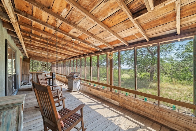 unfurnished sunroom featuring wooden ceiling