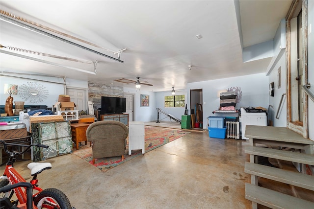 interior space with ceiling fan