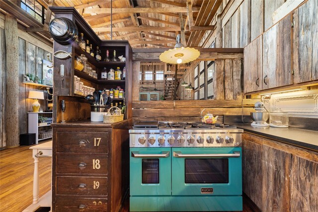 kitchen with wood ceiling, lofted ceiling, double oven range, and hardwood / wood-style floors